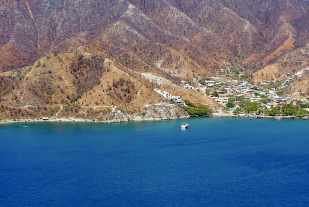 Beautiful blue water surrounded by mountains in Santa Marta, Colombia.